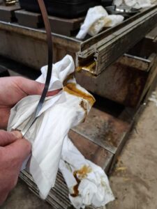 1. Removal of 1 of the 3 bearing tapes whilst wiping down most of the contamination, being careful not to kink any of the 4 tapes.