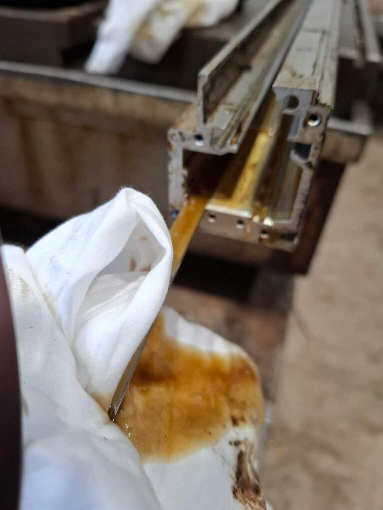 3. Another photo showing the level of contamination inside the linear scale with the grating tape still in situ.