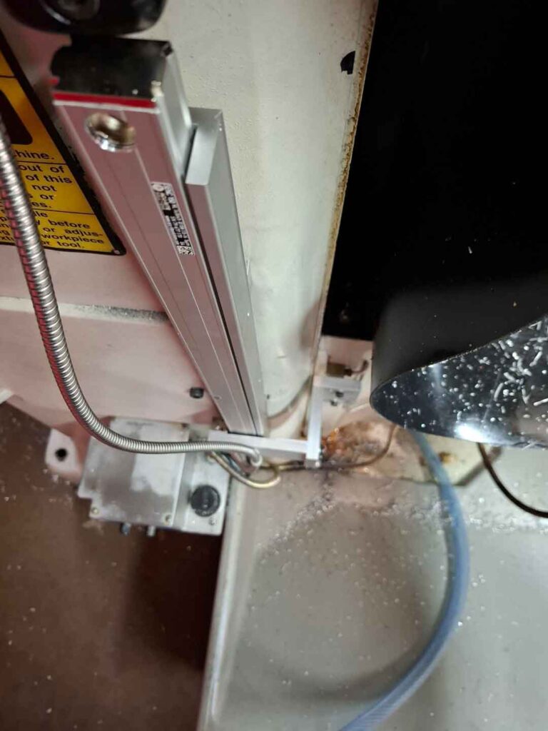 Ensuring clearance between head bracket and scale.