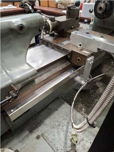 X axis fitted and guarded to Hardinge Lathe avoiding the oil pump pot.